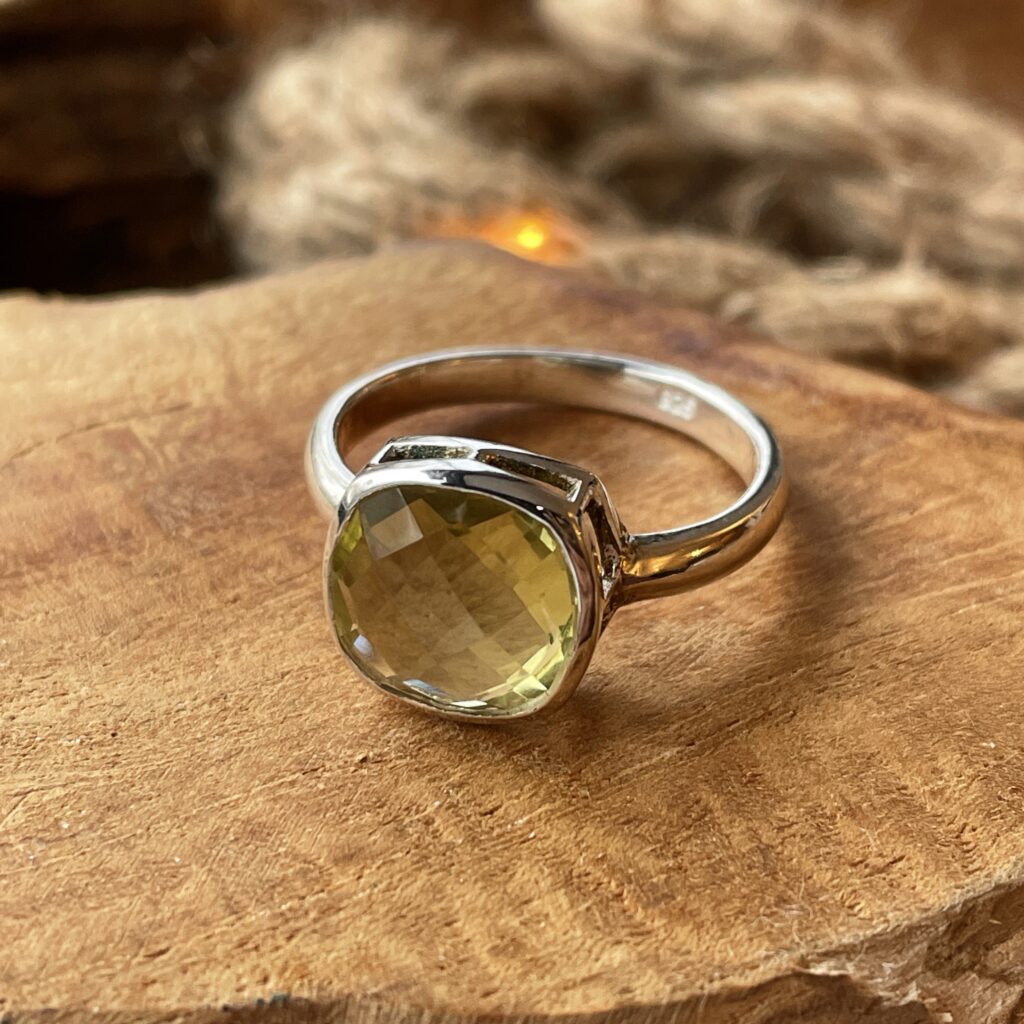 ring solitaire with cut lime topaz